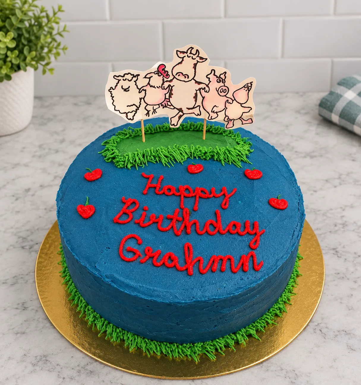 A welcoming cake studio counter with a finished buttercream cake and fresh flowers.